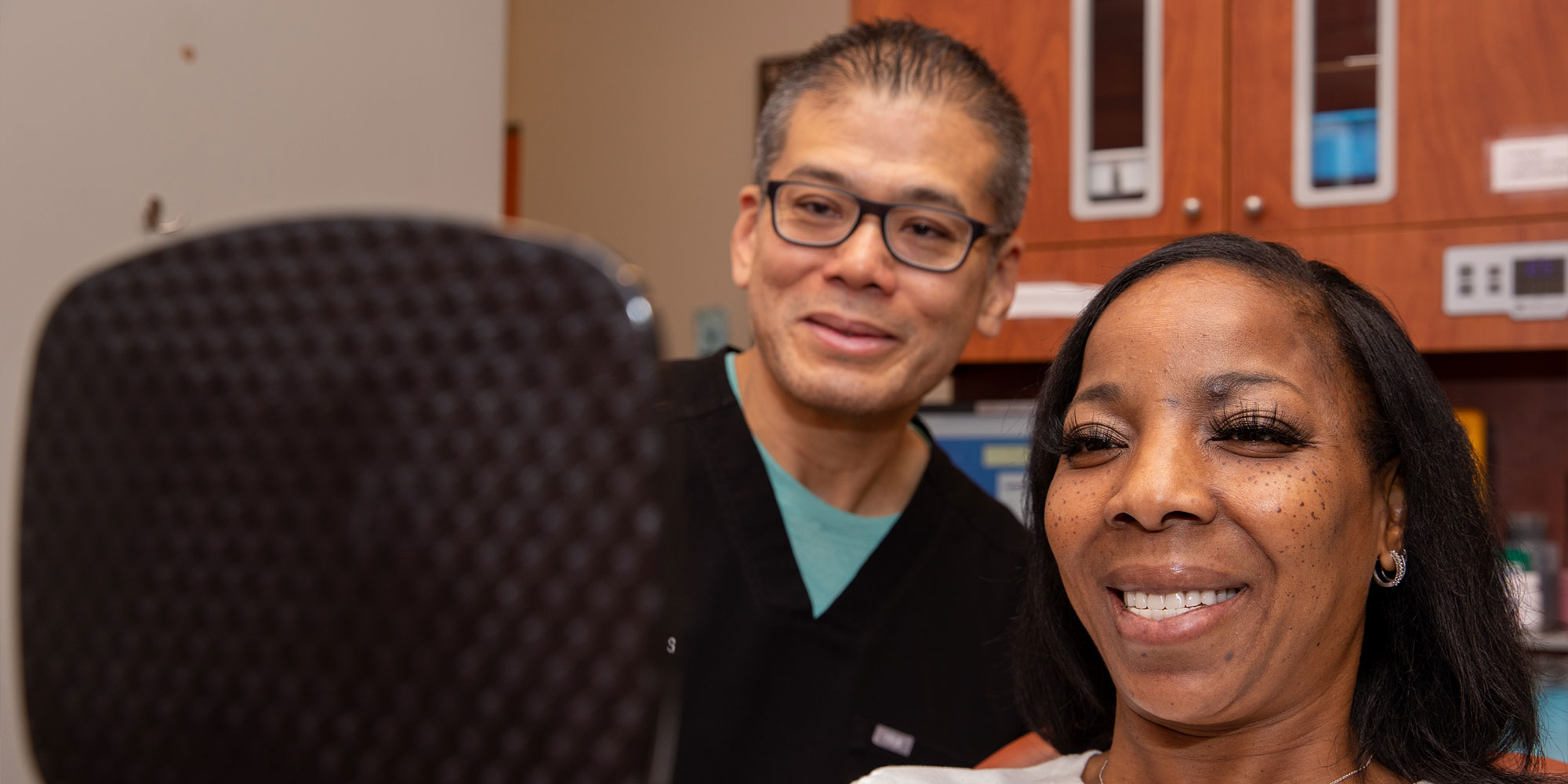 patient smiling brightly after their dental treatment