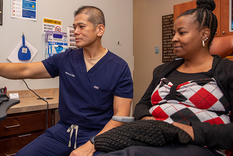 doctor and patient going over dental procedure information